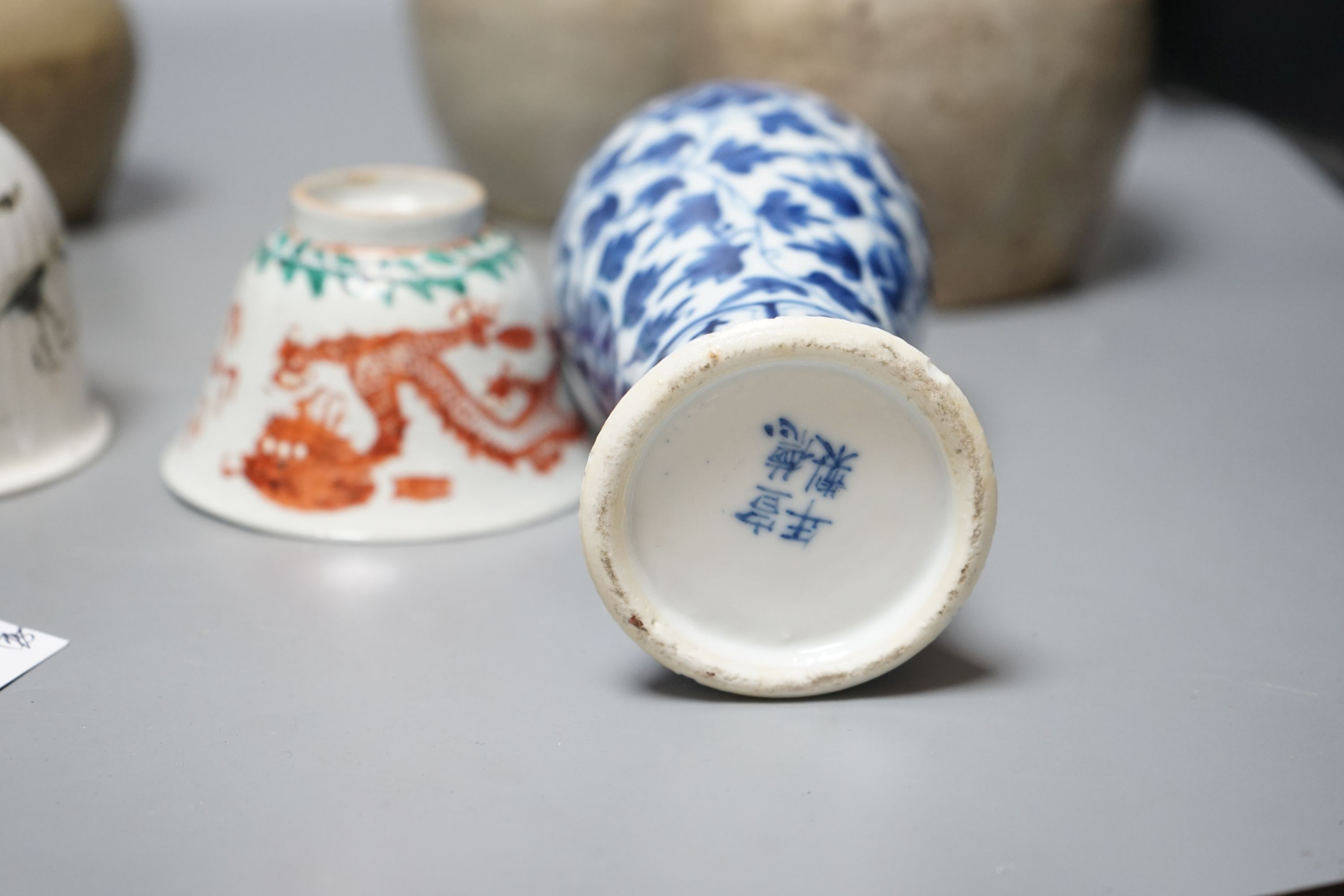 A Chinese blue and white vase, Xuande mark, c.1900, two late 19th Century Chinese cups and four Chinese provincial earthenware jars 19cm